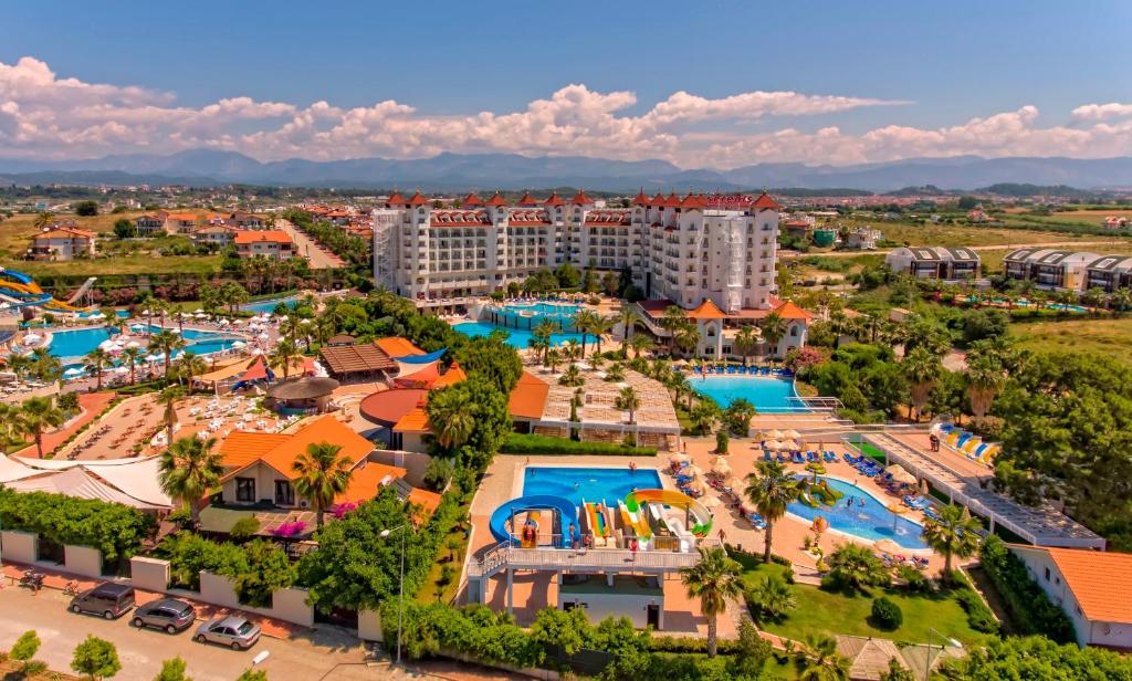 an aerial view of a resort with pools at Serenis Hotel in Side