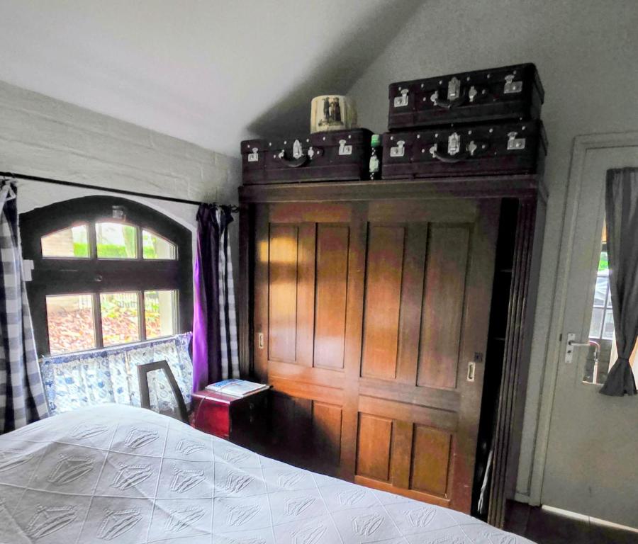 En eller flere senge i et værelse på Op Vakantie bij Nicole