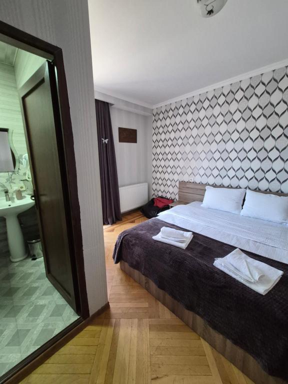 Postel nebo postele na pokoji v ubytování GIO-NIKA