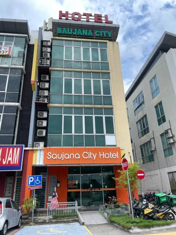 a hotel sign on the front of a building at Saujana City Hotel - Nearby KLIA in Bandar Saujana Putra