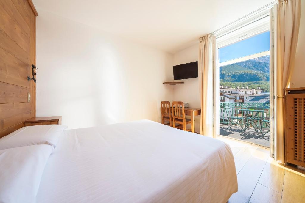 Voodi või voodid majutusasutuse Hotel Montana toas