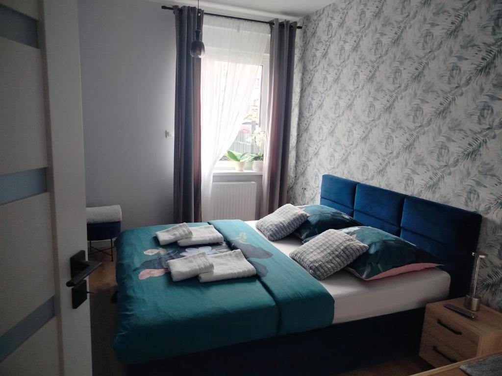 Postel nebo postele na pokoji v ubytování Apartament na Letniej