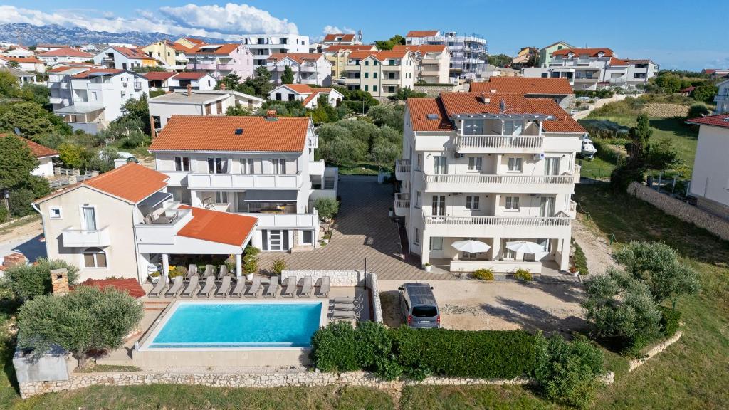 an aerial view of a house with a swimming pool at Villa Jurac in Povljana