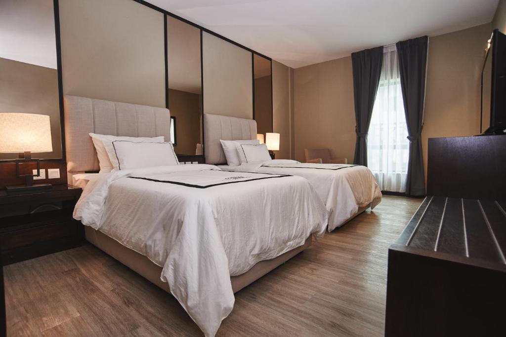 Postel nebo postele na pokoji v ubytování Corsica Hotel