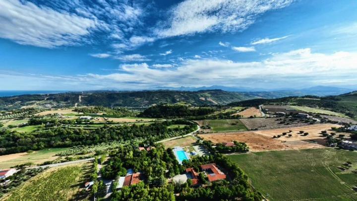 an aerial view of a resort with a swimming pool at Country House UNA in Cupra Marittima