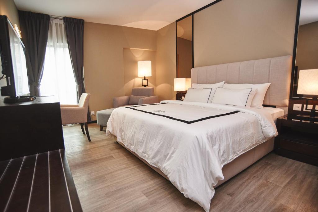 Postel nebo postele na pokoji v ubytování Corsica Hotel