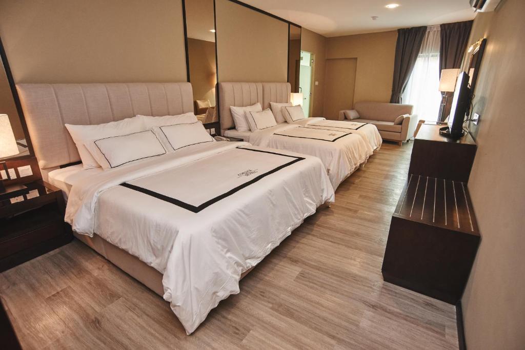Postel nebo postele na pokoji v ubytování Corsica Hotel
