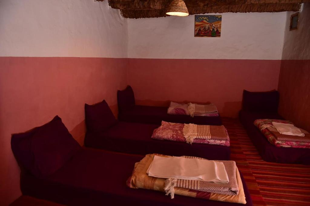 Een bed of bedden in een kamer bij Terregite Taghit