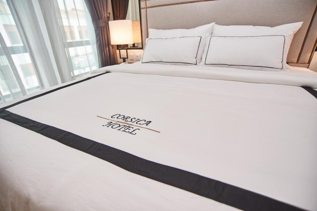 Postel nebo postele na pokoji v ubytování Corsica Hotel