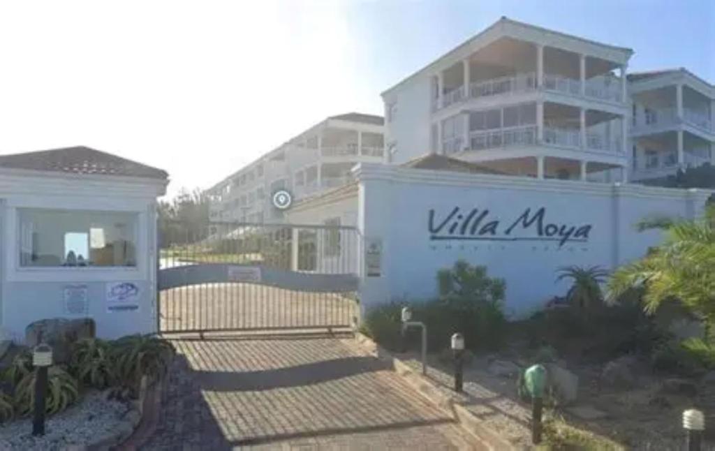 a white building with a sign that reads villa move at Villa Moya 46 in Margate