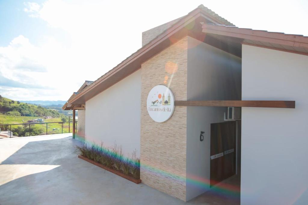 a building with a rainbow mural on the side at Pousada Encantos de Itá in Itá