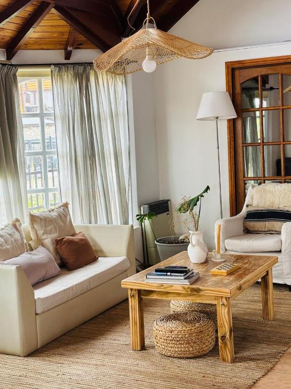 a living room with a couch and a coffee table at Las Margaritas in Ushuaia