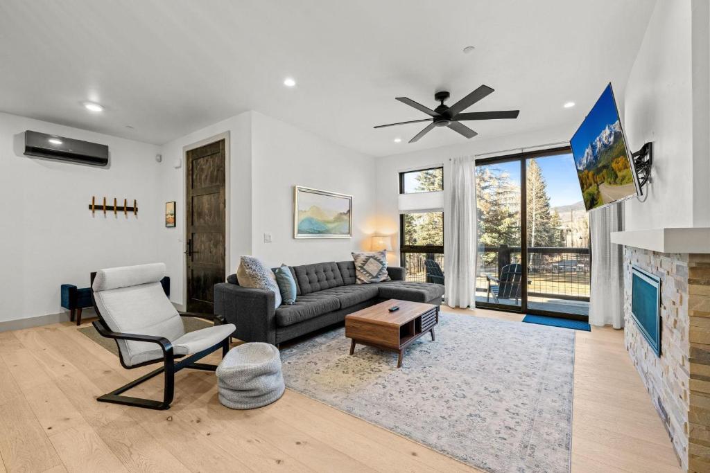 a living room with a couch and a fireplace at 50 East 6th Ave A3 in Silverthorne