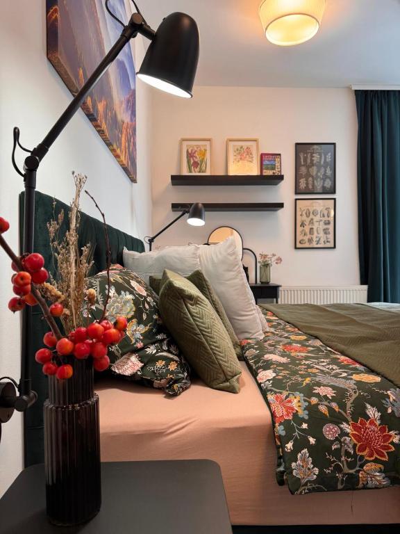a bedroom with a bed with a vase on it at Bylinkový Apartmán in Banská Bystrica