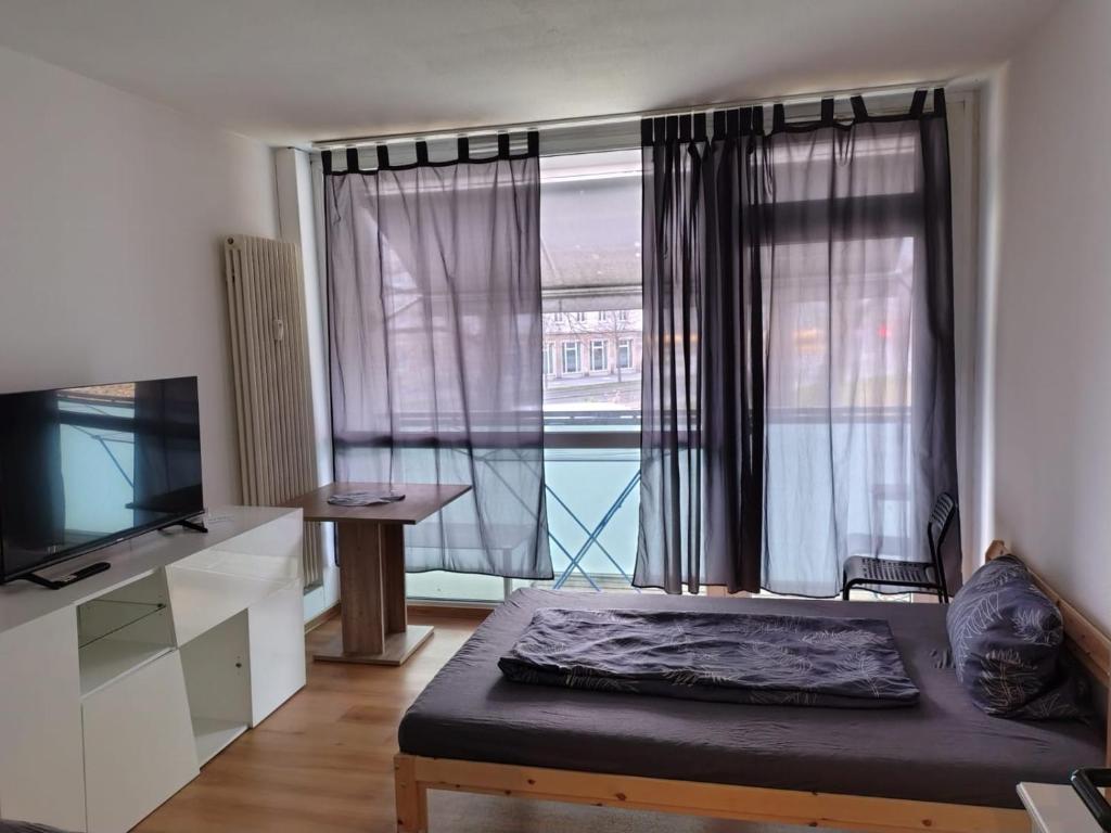 Ένα ή περισσότερα κρεβάτια σε δωμάτιο στο City Apartment