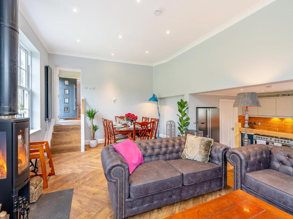 a living room with a couch and a fireplace at Hillside - Uk48202 in Stockbury