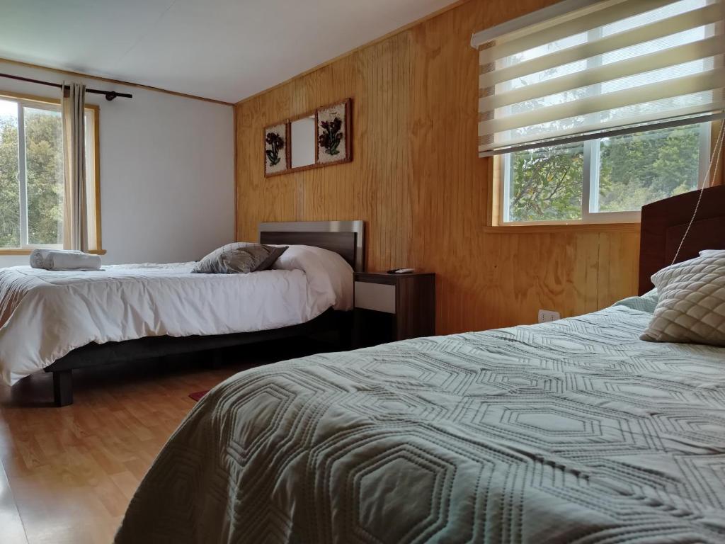 Postel nebo postele na pokoji v ubytování Cabañas el Remanso