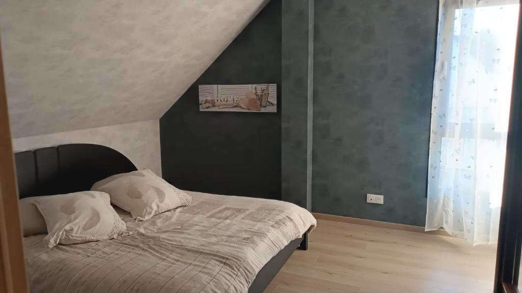 Postel nebo postele na pokoji v ubytování Le refuge d'Amma