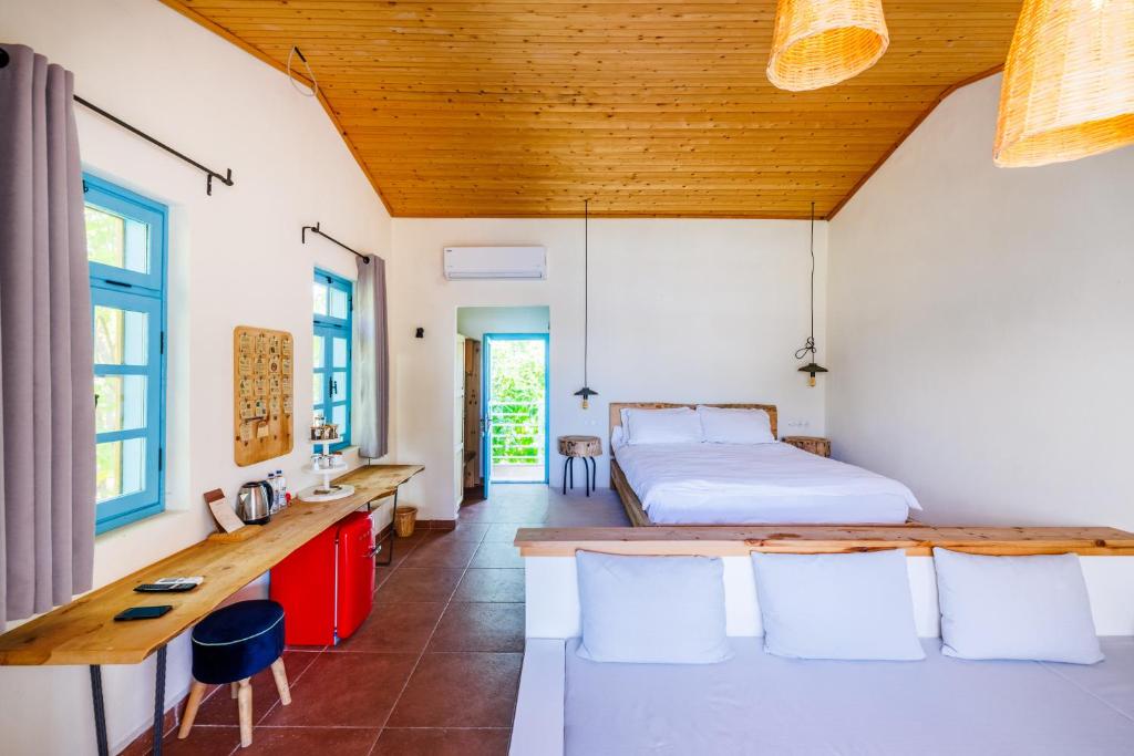 Postel nebo postele na pokoji v ubytování Yonca Lodge