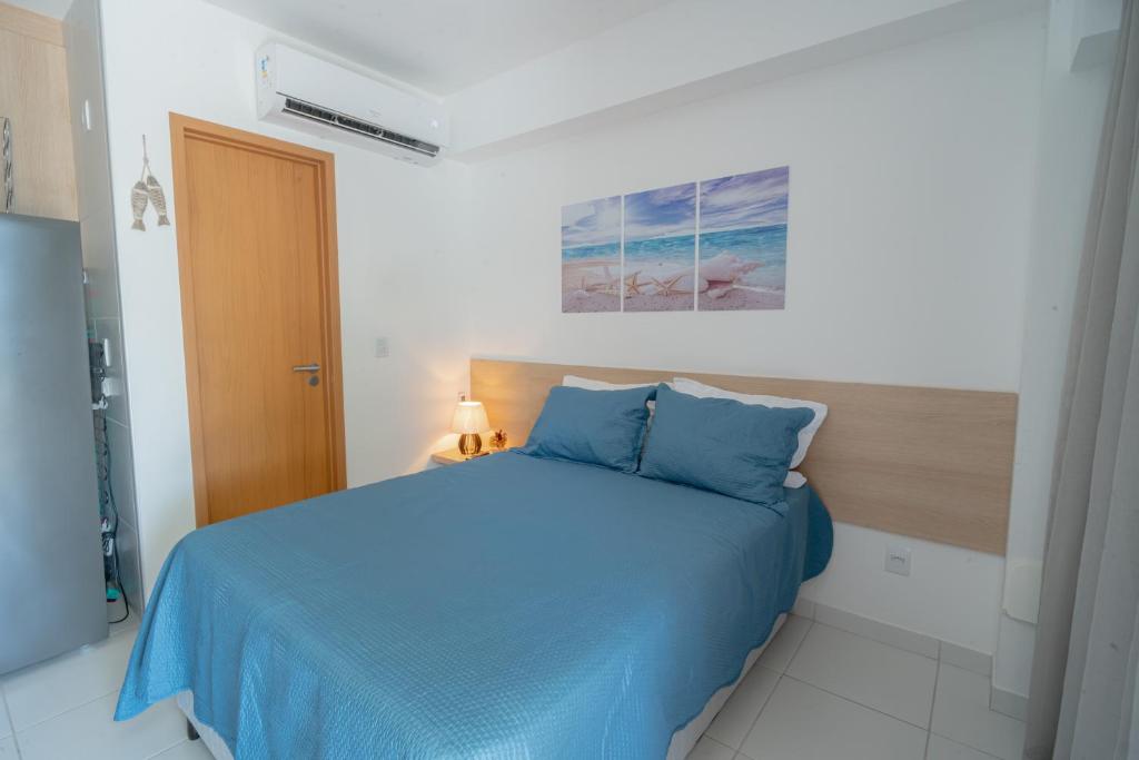 Giường trong phòng chung tại Refúgio Sol e mar Studio Resort em Muro Alto