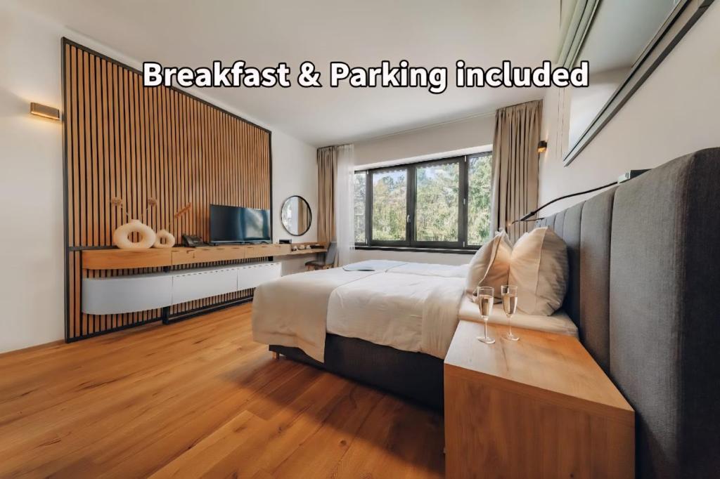 a bedroom with a bed and a television in it at Vista Resort & Club in Prague