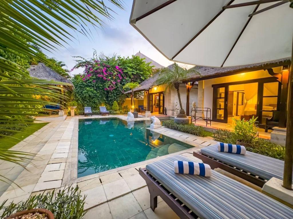 an image of a villa with a swimming pool at Arjuna Villa 3 Bedroom Villa Seminyak in Seminyak