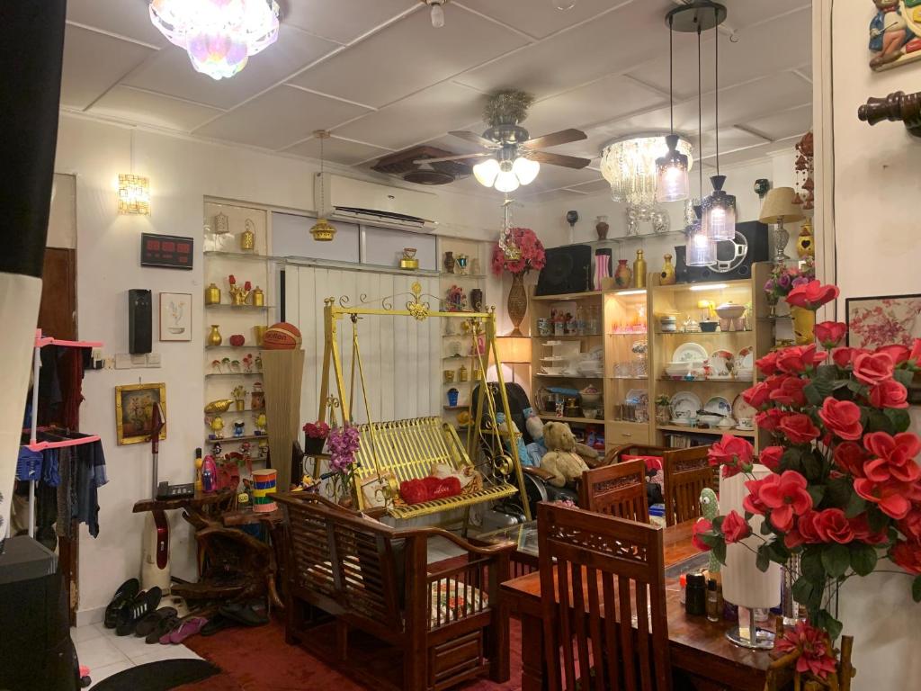 a room with a shop with chairs and a mirror at Rest Point 7 in Veyangoda