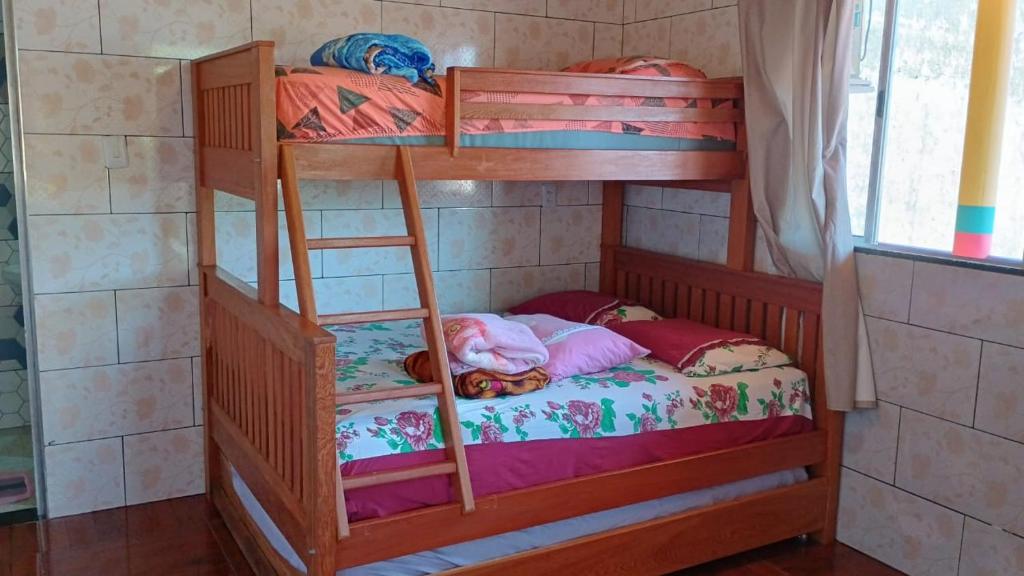 Ένα ή περισσότερα κρεβάτια σε δωμάτιο στο Point da ilha