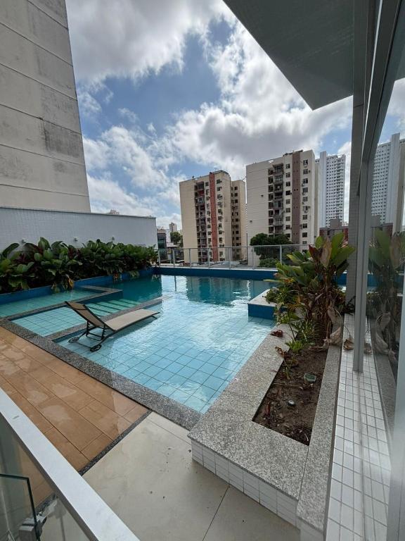 a swimming pool on the roof of a building at AP Premium Lazer Completo Academia Rooftop Coworking e Estacionamento in Belém