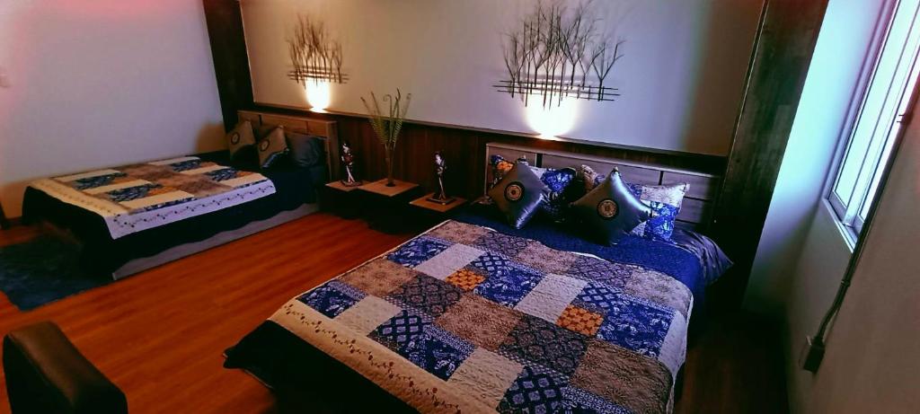 Ένα ή περισσότερα κρεβάτια σε δωμάτιο στο Bamboo Residence