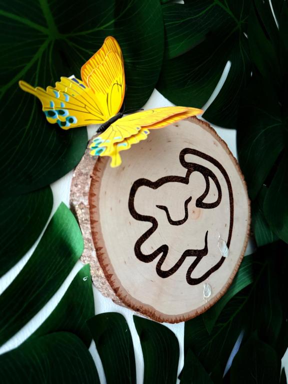 a cake with a butterfly on top of it at La Belle et le Nooki in Meaux