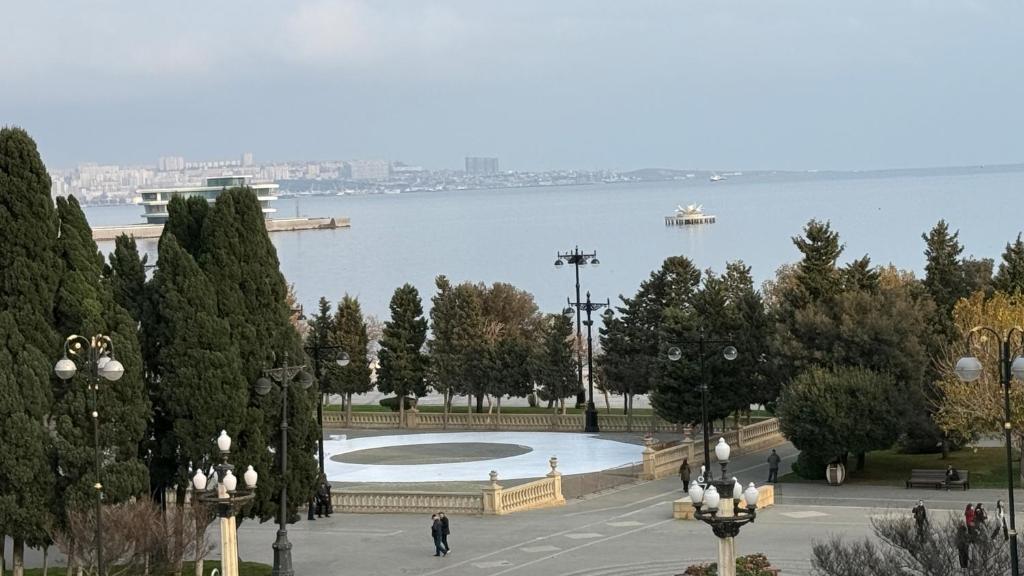a view of a park with the water in the background at Mayden Tower apartment in Baku