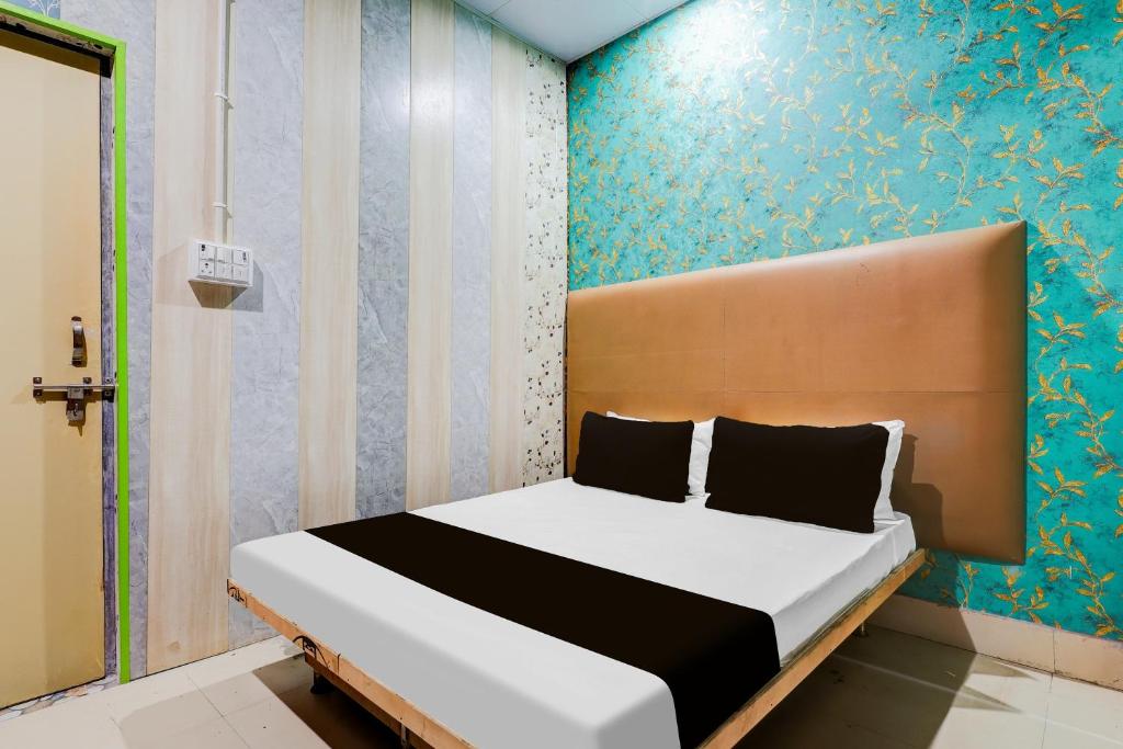 Ένα ή περισσότερα κρεβάτια σε δωμάτιο στο Hotel O Shotel