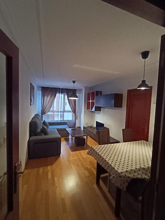 a living room with a couch and a table at Apartamento Guarnizo in Guarnizo
