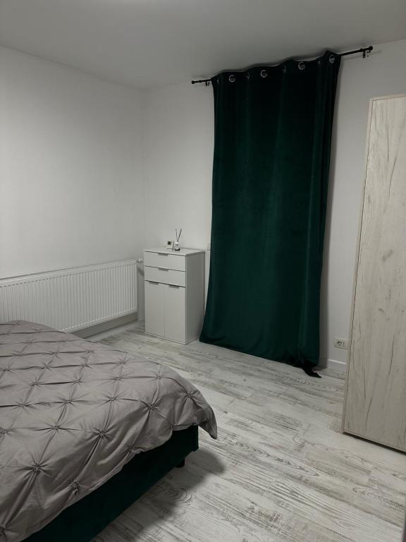 Postel nebo postele na pokoji v ubytování Apartament