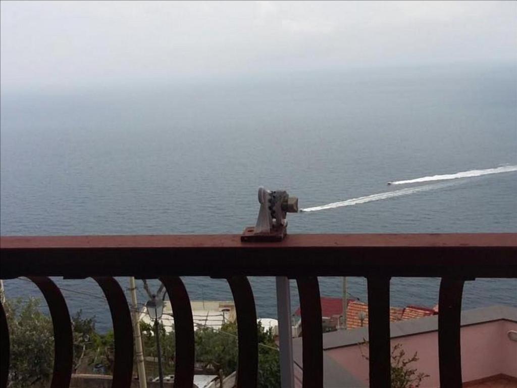 a camera on a balcony looking at the ocean at La Pizzerella di Amalfi in Amalfi