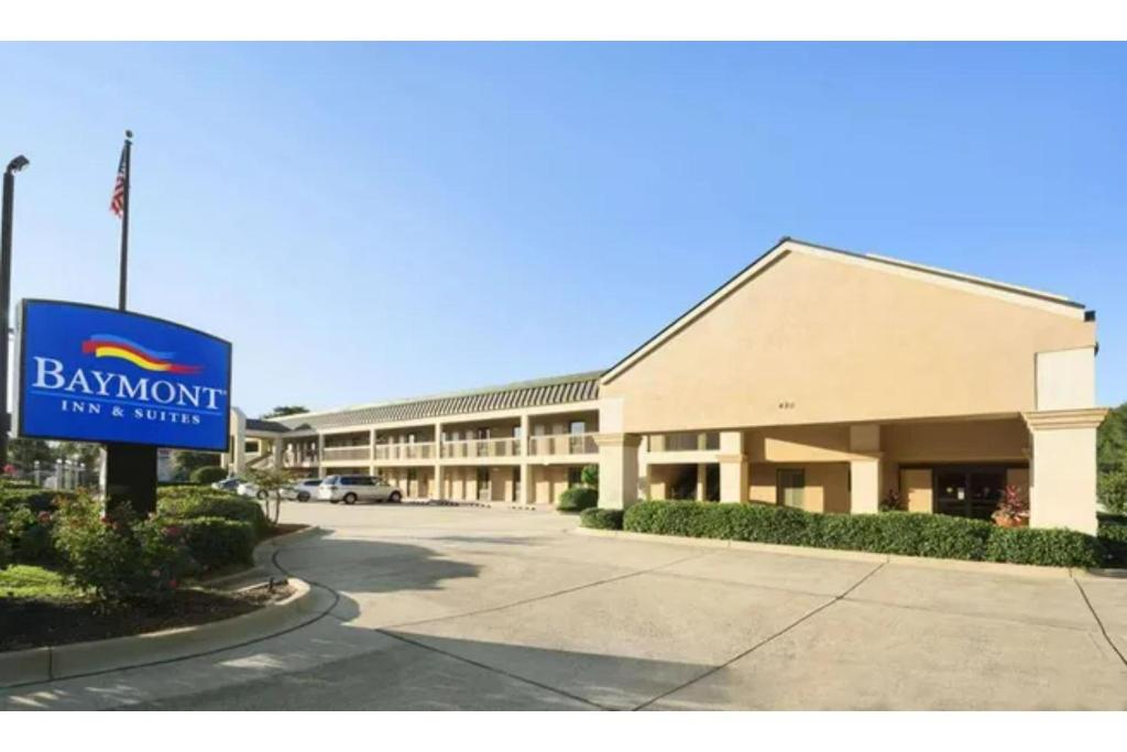 a large building with a sign in front of it at Townhouse Fort Walton Beach Hurlburt Field in Mary Esther