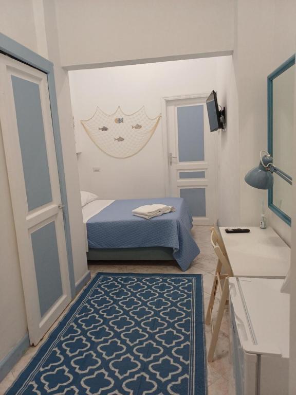 Giường trong phòng chung tại Le Stanze del Mare - B&B