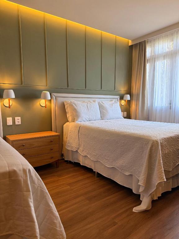 a bedroom with a large bed and a window at Pousada Macamirim in Macaíba