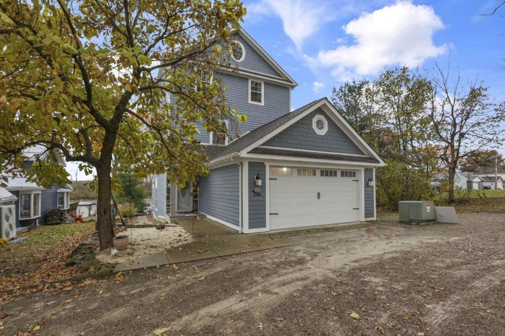 a house with a garage and a driveway at The Lakehouse in Buckeye Lake