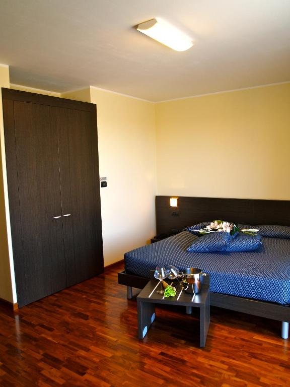 Postel nebo postele na pokoji v ubytování Draconerium Hotel