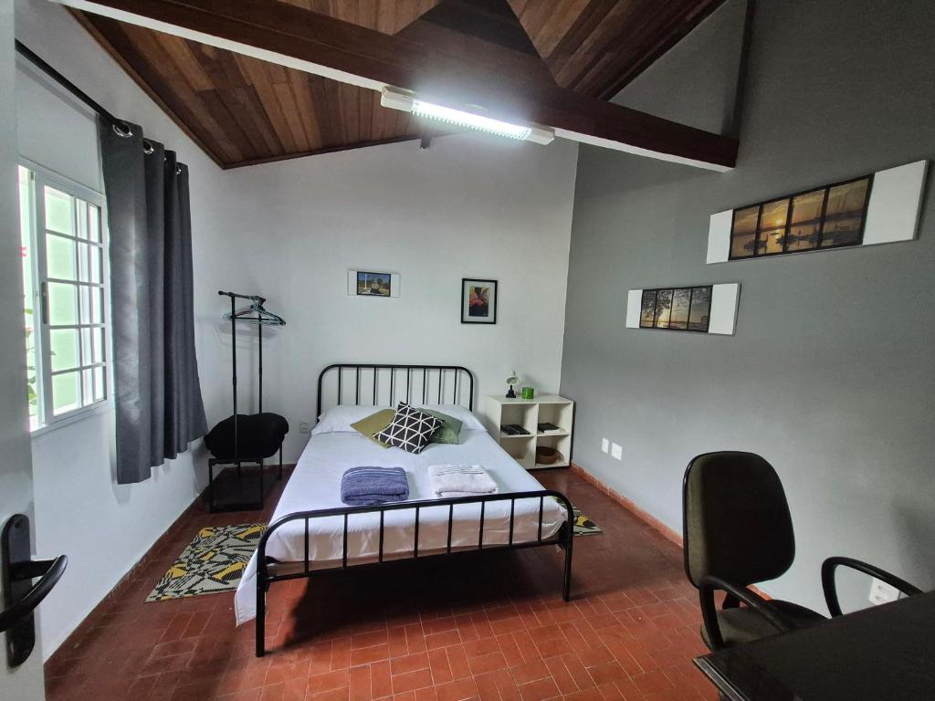 Postel nebo postele na pokoji v ubytování Chalé de Sampa