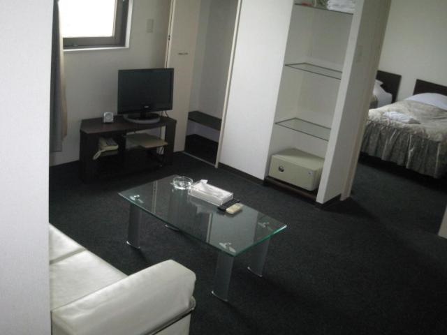Postel nebo postele na pokoji v ubytování Sakura Hotel Oami