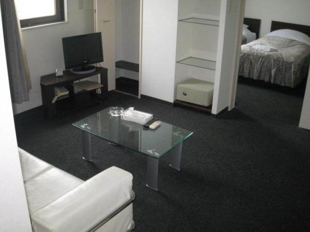 Postel nebo postele na pokoji v ubytování Sakura Hotel Oami