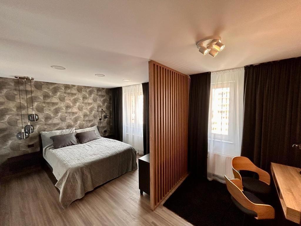 Ένα ή περισσότερα κρεβάτια σε δωμάτιο στο Urban Plaza Business Apartment