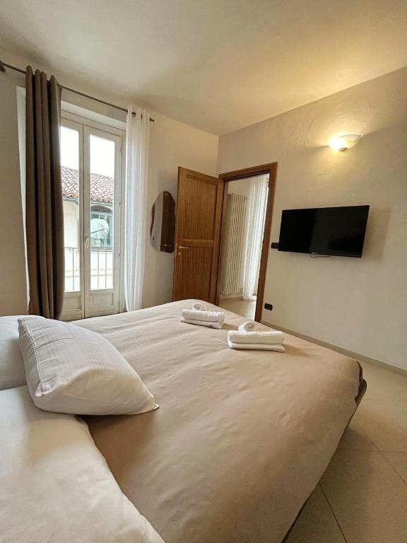 Postel nebo postele na pokoji v ubytování Il Nido dei Mondagli