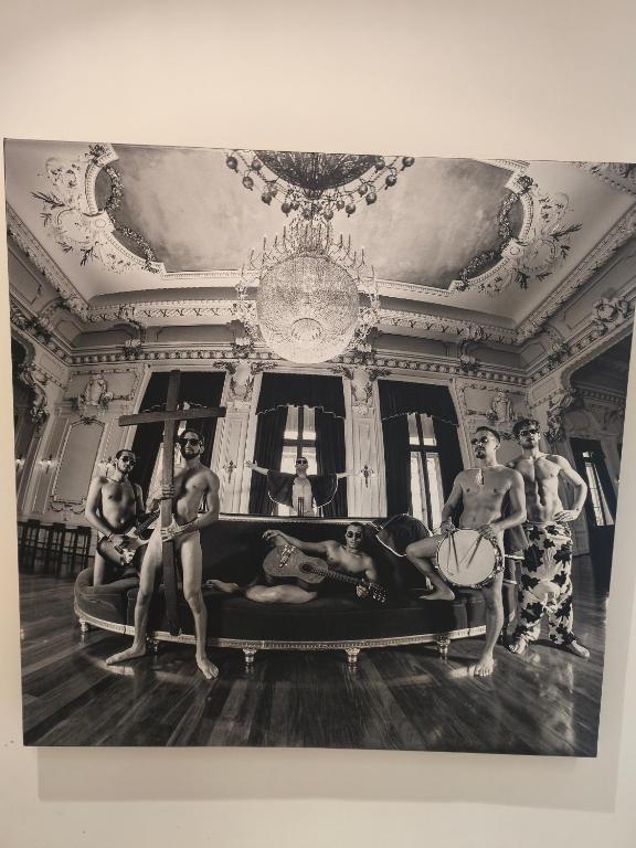 a group of men sitting on a couch in a room at Orion Casais in Casais