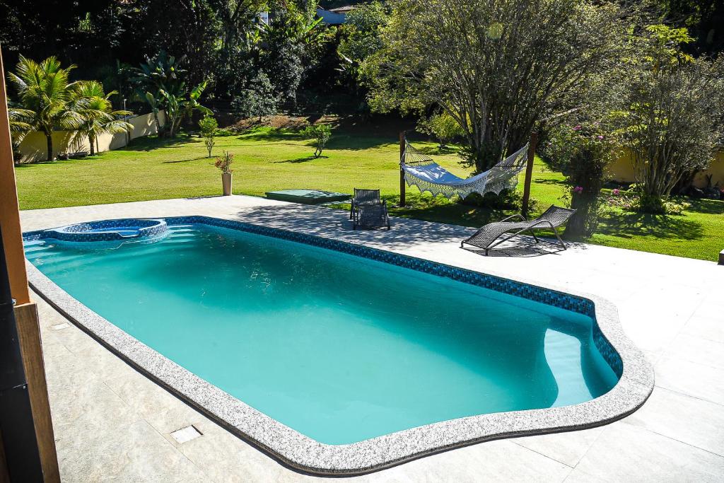 Bazén v ubytování Chácara Wermelinger nebo v jeho okolí