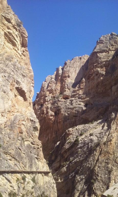 a view of a rocky mountain with a blue sky at Hostal Caminito del Rey in Alora