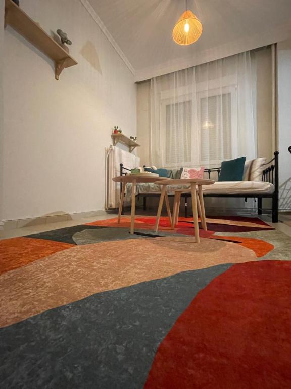 a living room with a table and a couch at Anastasia's House in Florina